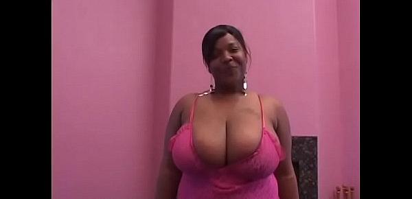  Well-padded black housewife in pink outfit with huge boobs Angie is not against to have sex with couple of horny studs